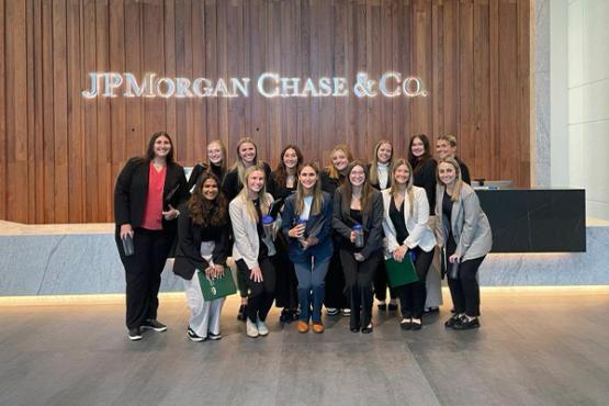 Business students pose at JPMorgan & Chase
