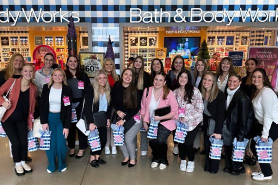 Business students pose at Bath & Body Works