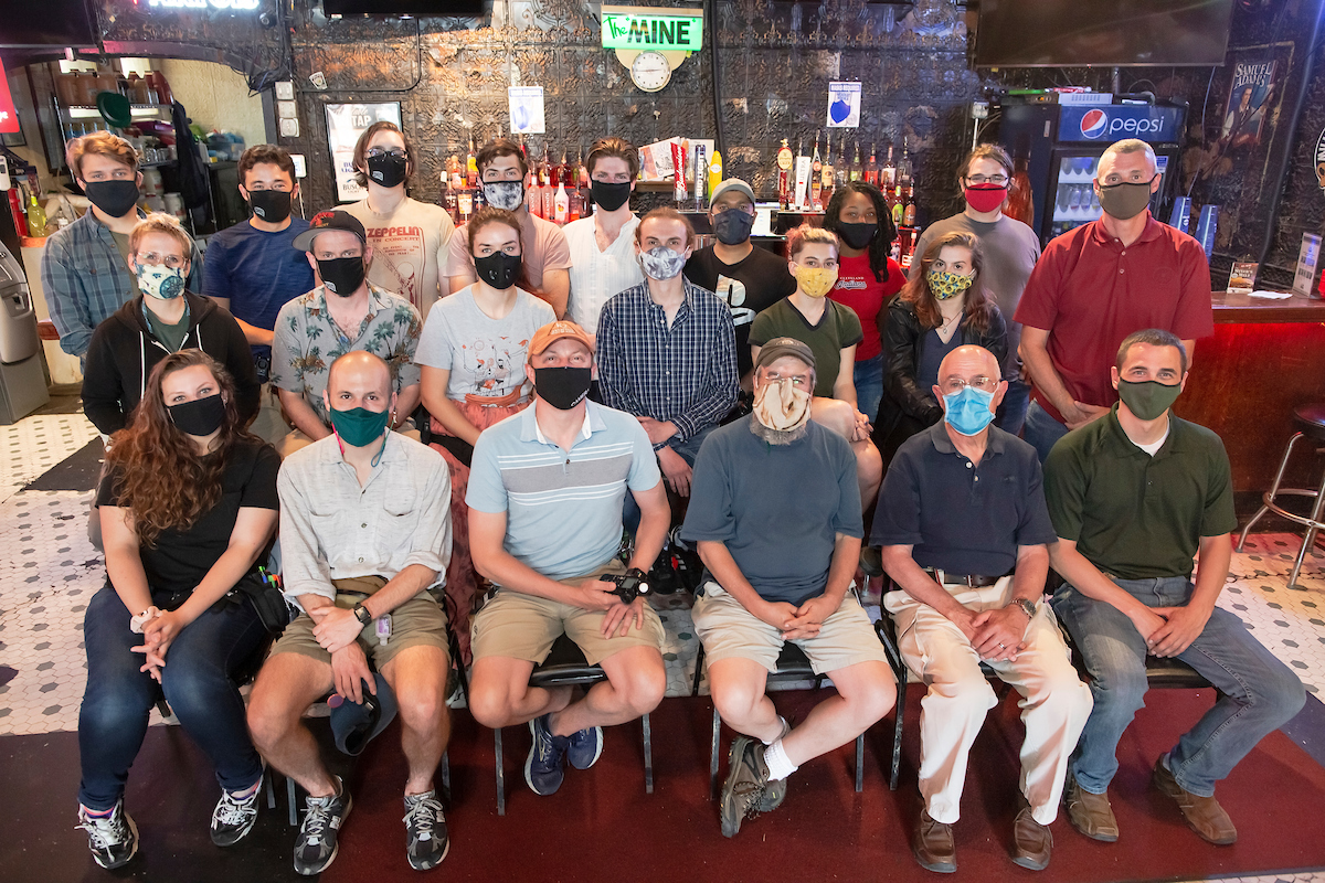 The OHIO 360 project team seated in two rows on location in 2021.