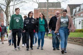 A tour guide leads a campus tour.