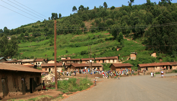 Rural town in Africa, with houses in the background.
