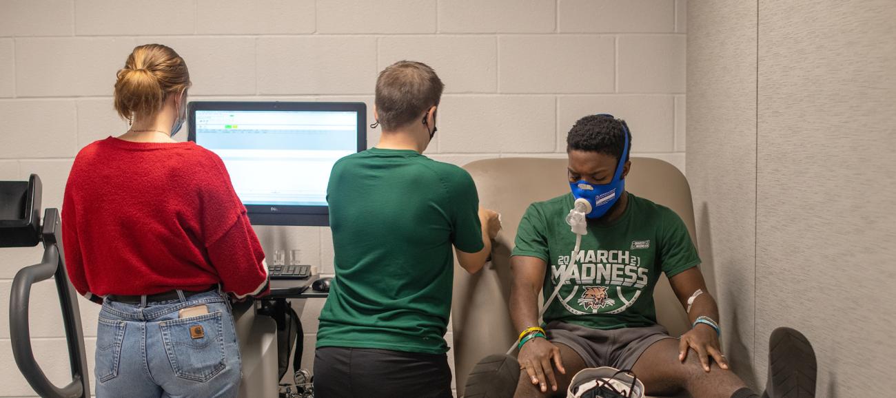 Exercise students in research lab in Grover