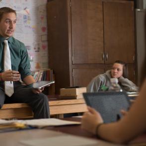 Teacher in a classroom talking to students