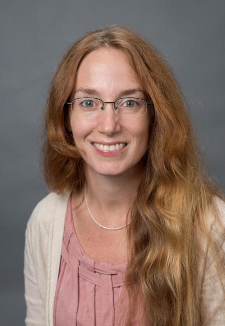 Headshot of a smiling Trina Gannon in a pink blouse and white sweater