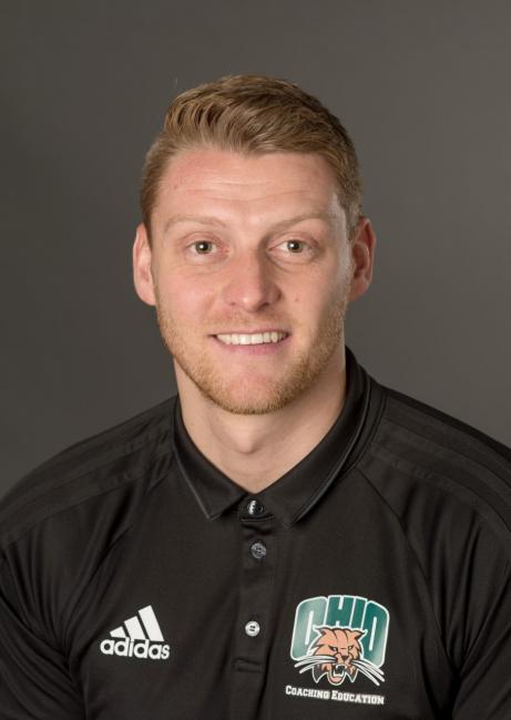 Headshot of a smiling Ashley Allanson wearing a green Ohio University polo