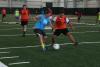 Soccer players being coached