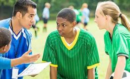 Coach talking to his players