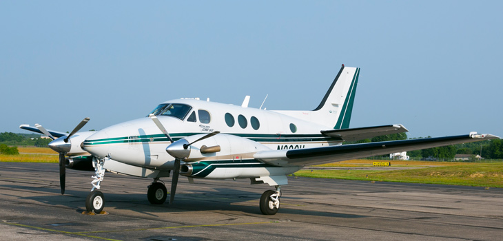 King Air parked on a landing strip