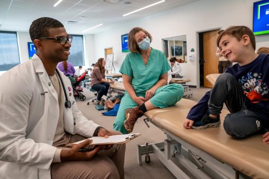 HCOM faculty and student at CTAC pediatrics lab