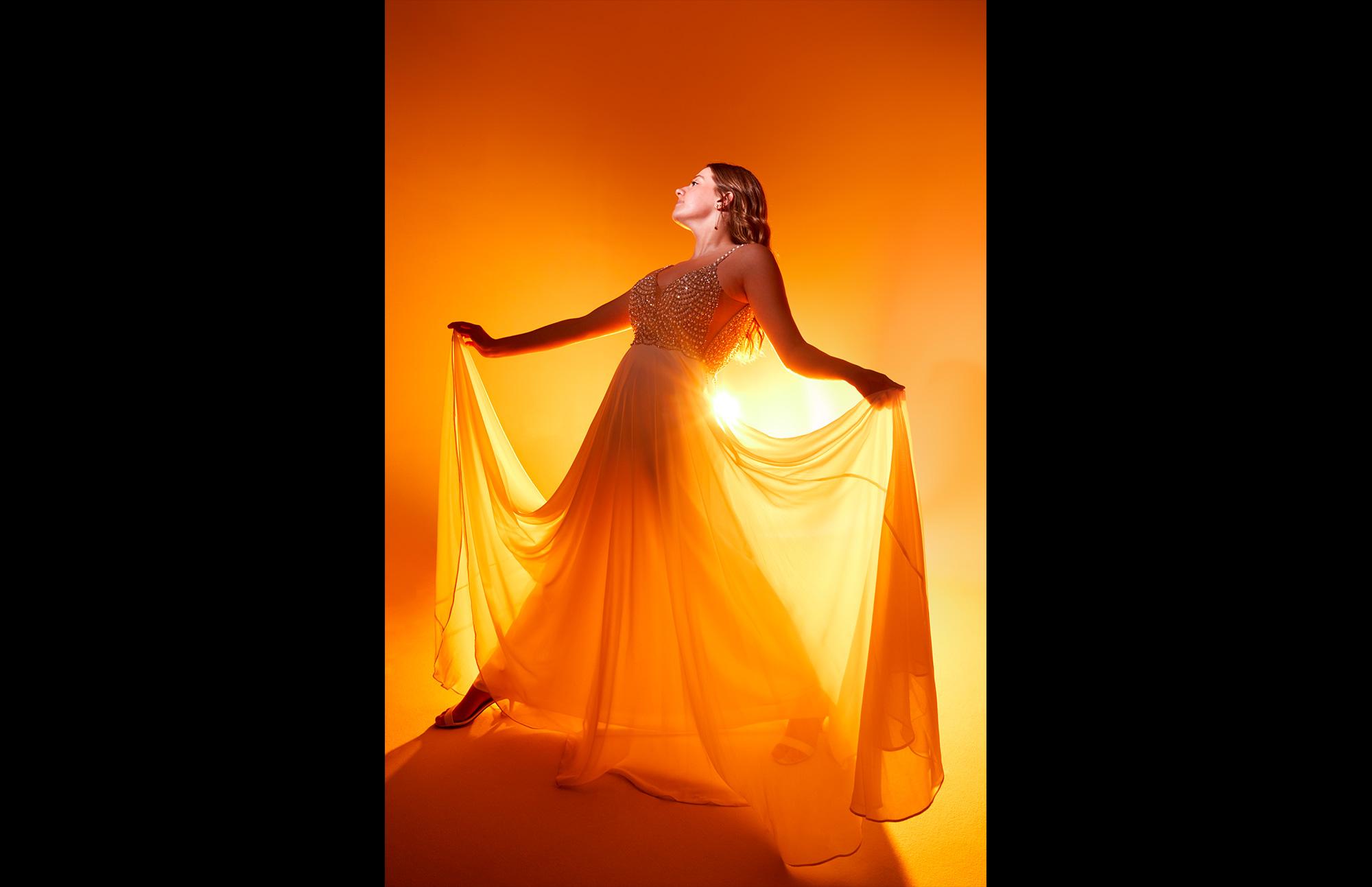 woman in studio with orange light