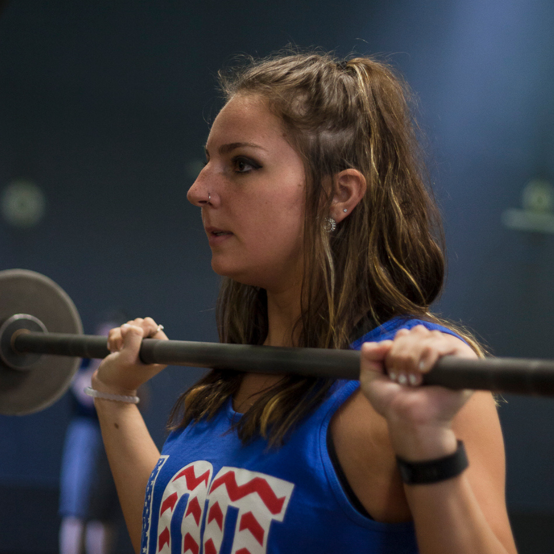 Female Student Lifting Weights 