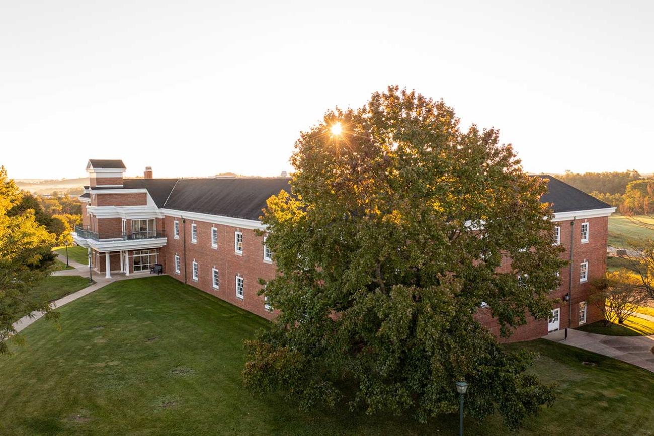 Photo of a building and tree on the Eastern campus