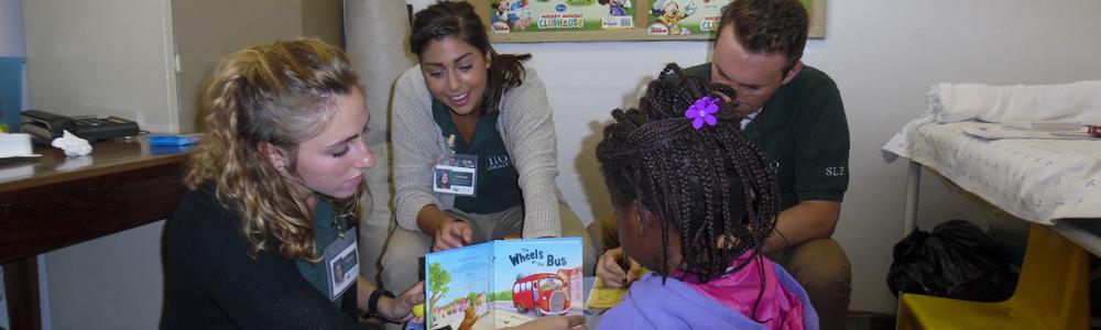 Botswana Rehab Services Students reading to children