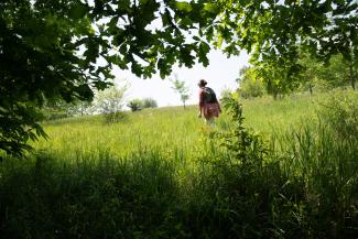 A student performing research at Ohio University's Land Lab