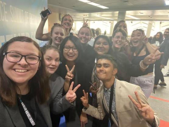 Students in Bangkok Thailand for UN Emerging Leaders Peace Conference are giving the peace sign