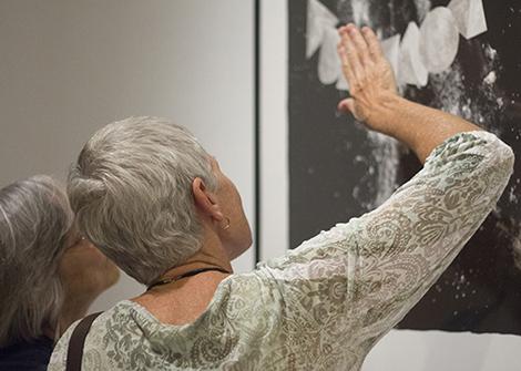 Woman looking at art in a museum