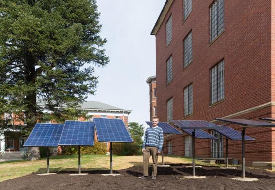 Alex Burke with PV Panels