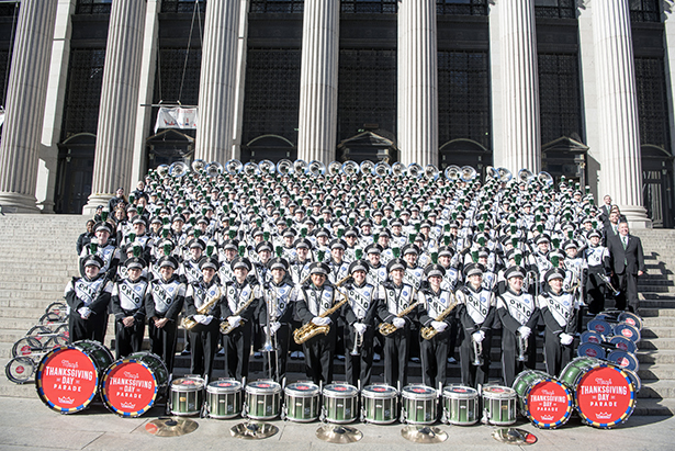 The Marching 110 pose for a group photo following the Macy's Parade.