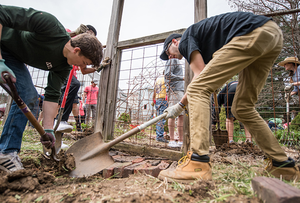 Volunteers work to spruce up a garden at the Dairy Barn Arts Center.