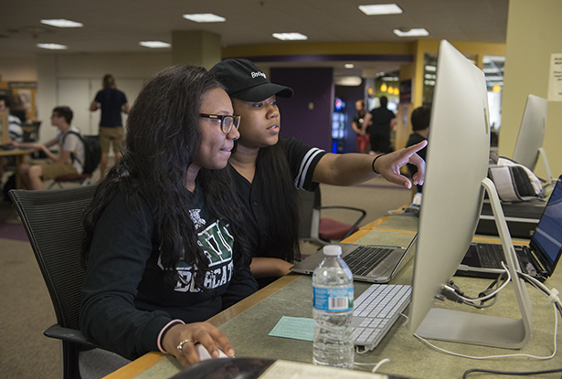 (From left) Mariah Jarrett, a sophomore in specialized studies, and Briana Craia, a sophomore studying retail merchandising and fashion product development, work on an assignment together on the second floor of Alden Library.