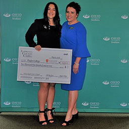 Nicole Pennington, dean of Ohio University Southern, congratulates Anna Kimball on receiving a $2,500 scholarship from the Lawrence County Chamber of Commerce.