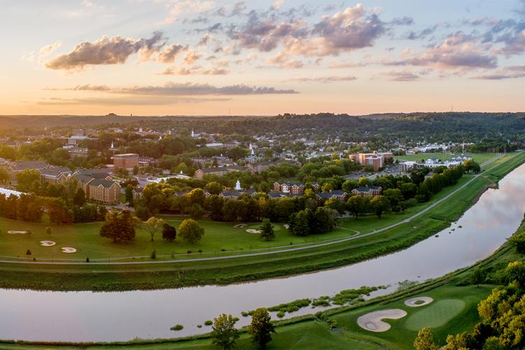 Aerial view of the Athens campus with the Hocking River on one side and rolling Appalachian hills on the other