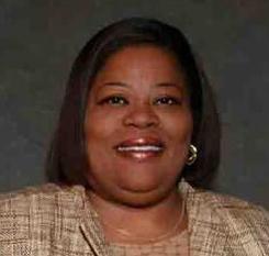Tara Fikes's profile picture Headshot of Tara Fikes, smiling African American woman with chin length hair and tan suit.
