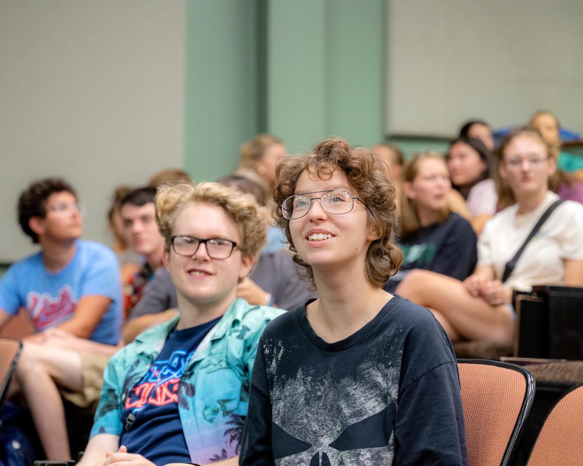 Students participating and smiling at an activity at Honors Early Experience Program