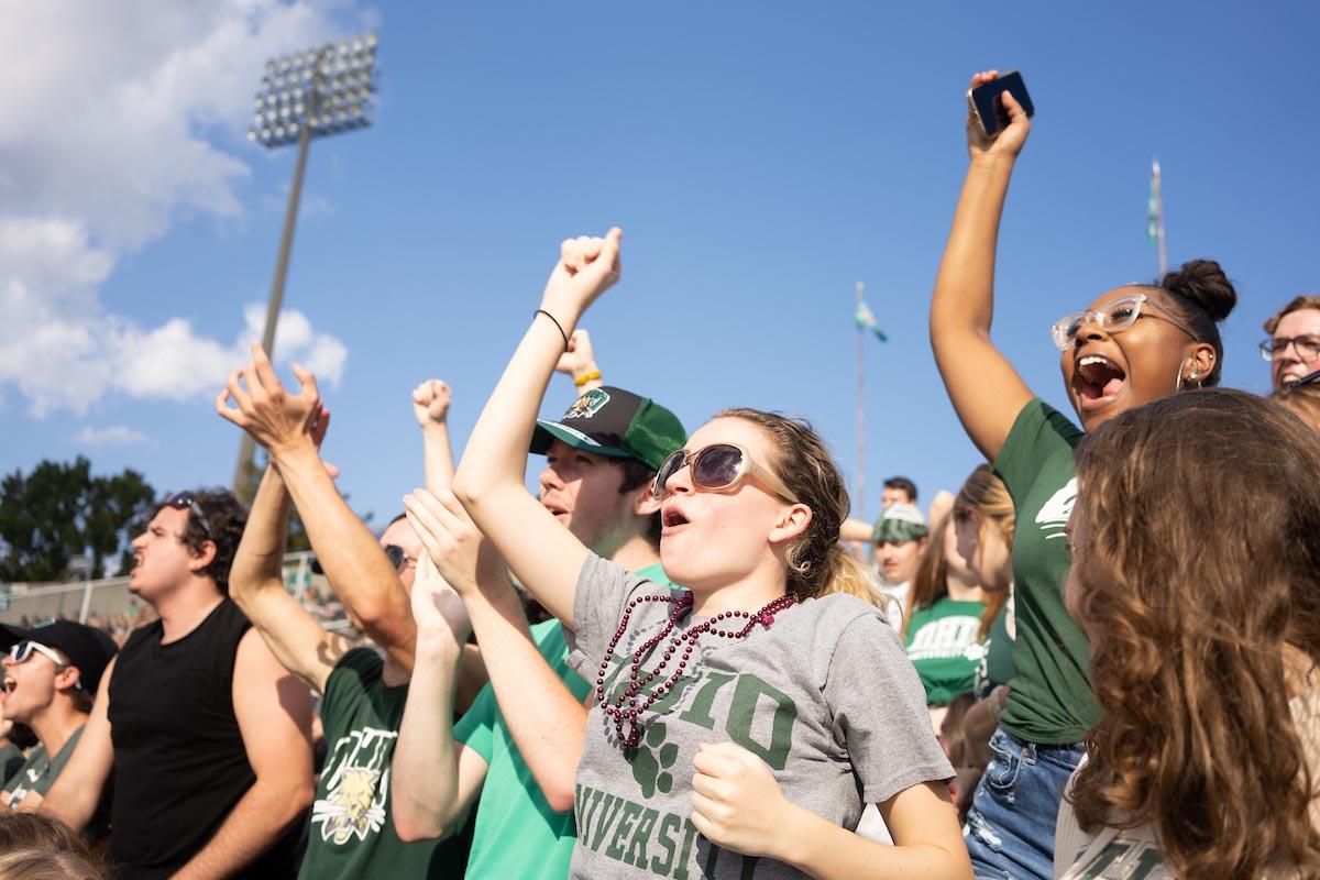 Students cheer at an Ohio University football game