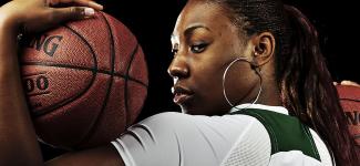 OHIO women's basketball player poses with basketballs