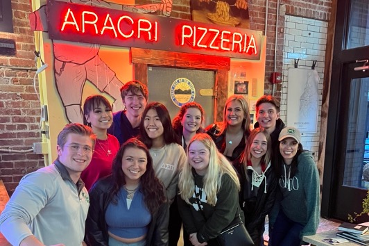 students posing at pizza shop in columbus ohio