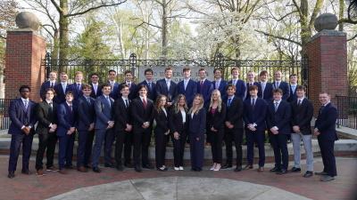 group of students in front of OU gateway