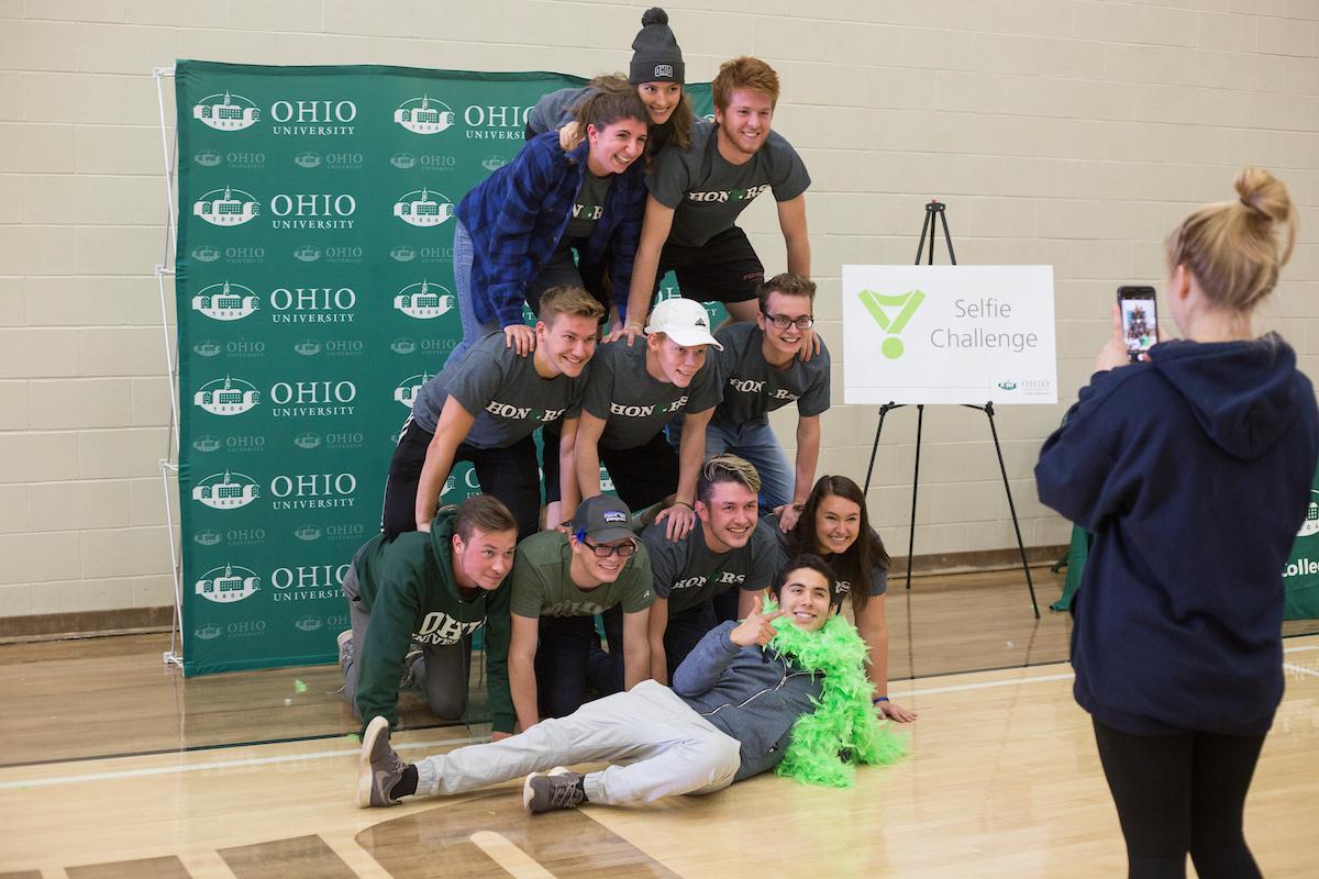 College of Business students form a human pyramid