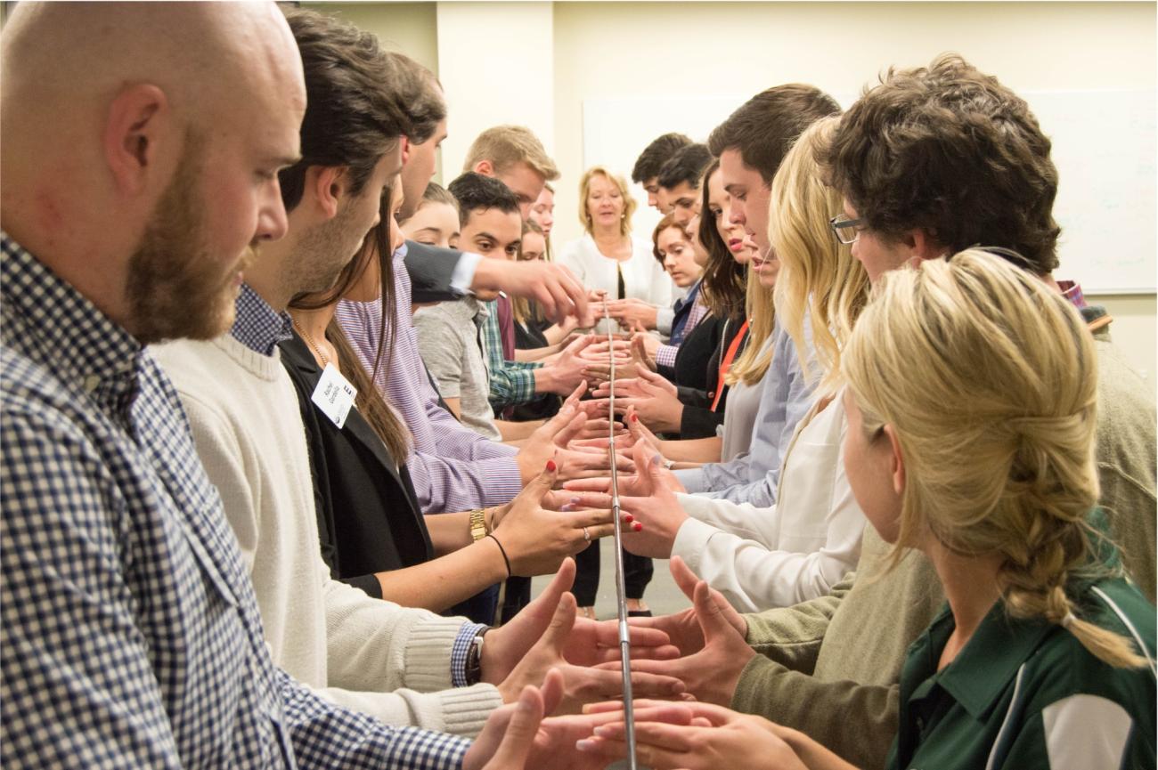 Leadership Students in a team pole challenge