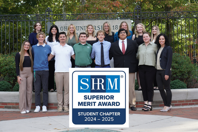 SHRM Group posing with SHRM Merit Award Winner Badge 