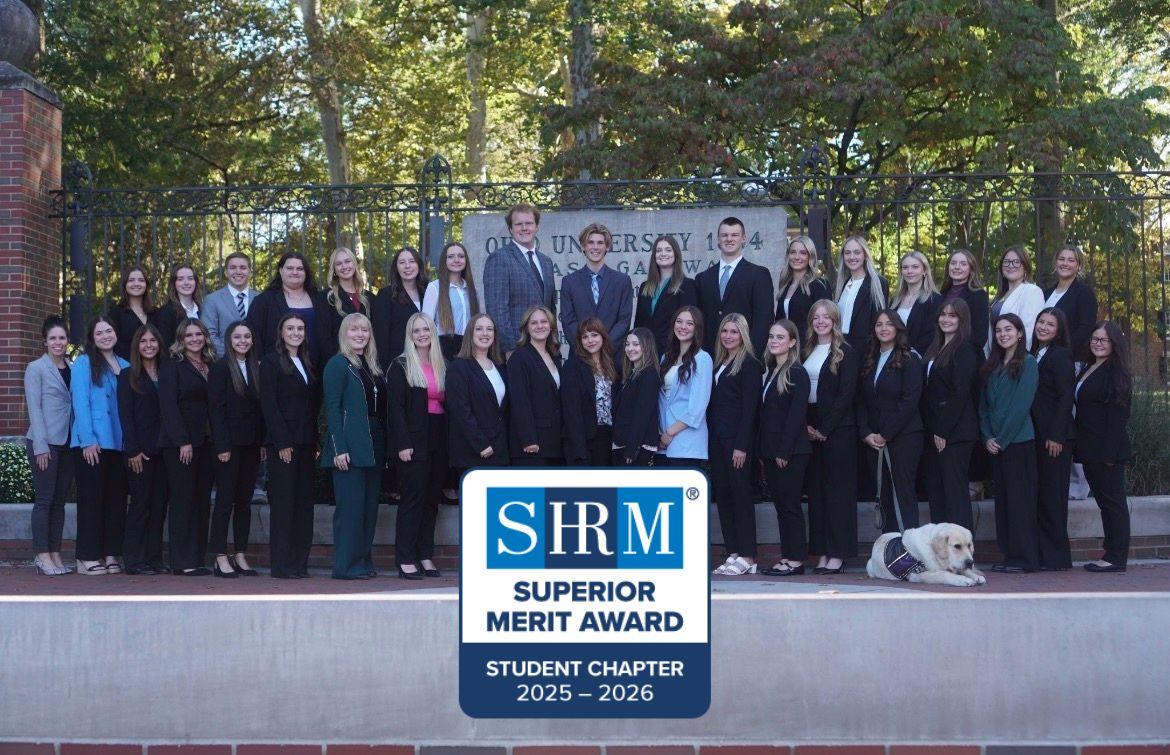 group of shrm students in front of OU gate
