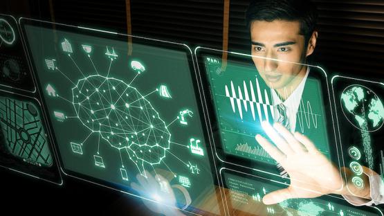 Man looking at analytics on multiple screens