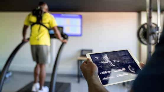 Person on a treadmill completing a fitness exam