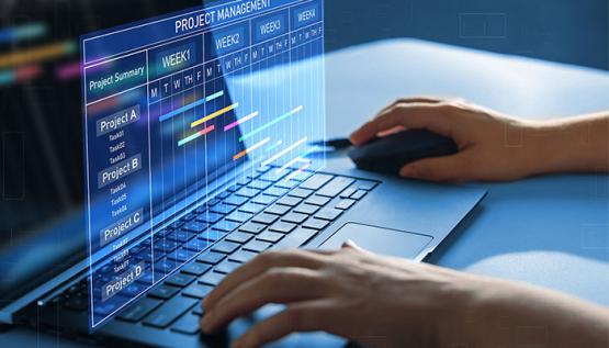 Hands on laptop with animated project management calendar hovering above keyboard