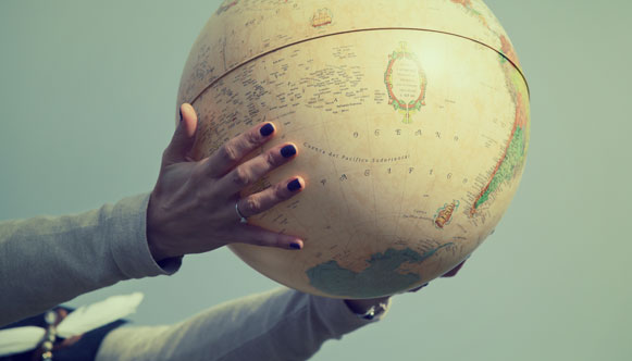 Woman holding globe of world