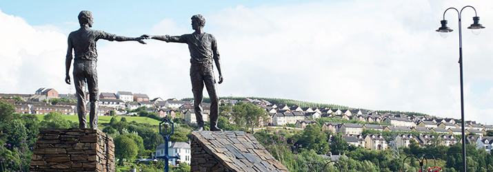 The iconic "Hands Across the Divide" statue in Derry symbolizes the spirit of reconciliation and hope for the future after decades of conflict in Northern Ireland.