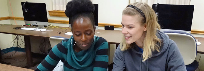 Students enjoy learning about American culture. From left: Francisca Lekey and Anna Palmer focus on organizing and developing their thoughts for the next phase of their thesis.