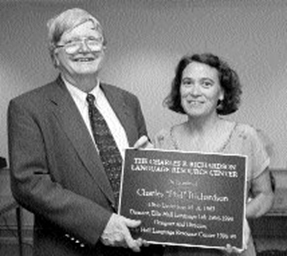 Charles P. Richardson and Mary Jane Kelley, holding plaque