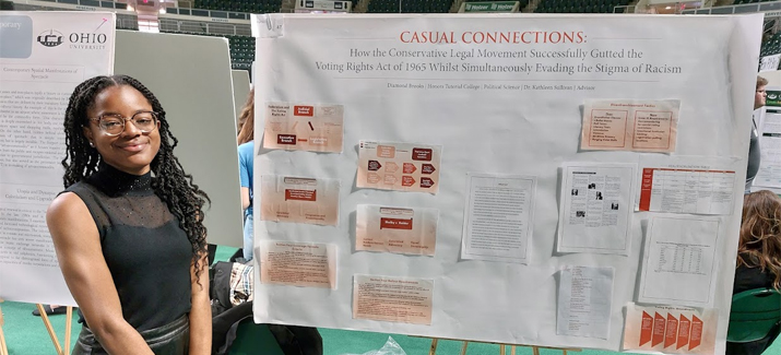 Diamond Brooks presents her poster on "Casual Connections" at the Student Research and Creativity Expo
