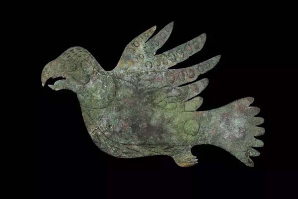 A copper effigy depicting a peregrine falcon excavated from the Mound City Group unit of Hopewell Culture National Historical Park. NPS Photo / Tom Engberg