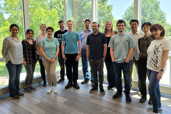Chemistry graduate students group photo with Dr. Eric Masson