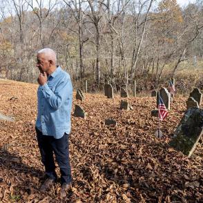 David Butcher stands in a cemetary at Tablertown 
