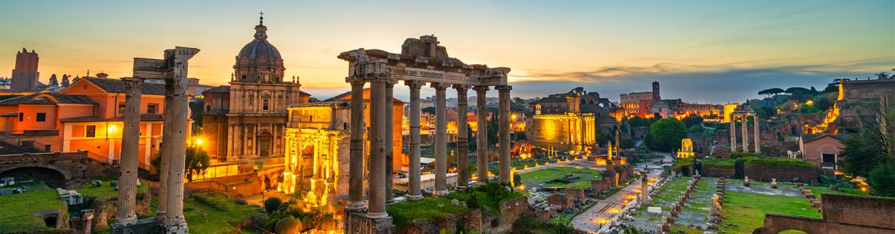 A stock image of the Ruins of Roman forum at dawn in Rome, Italy