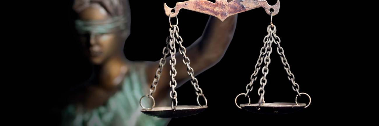 illustration of a blind lady justice with a scales