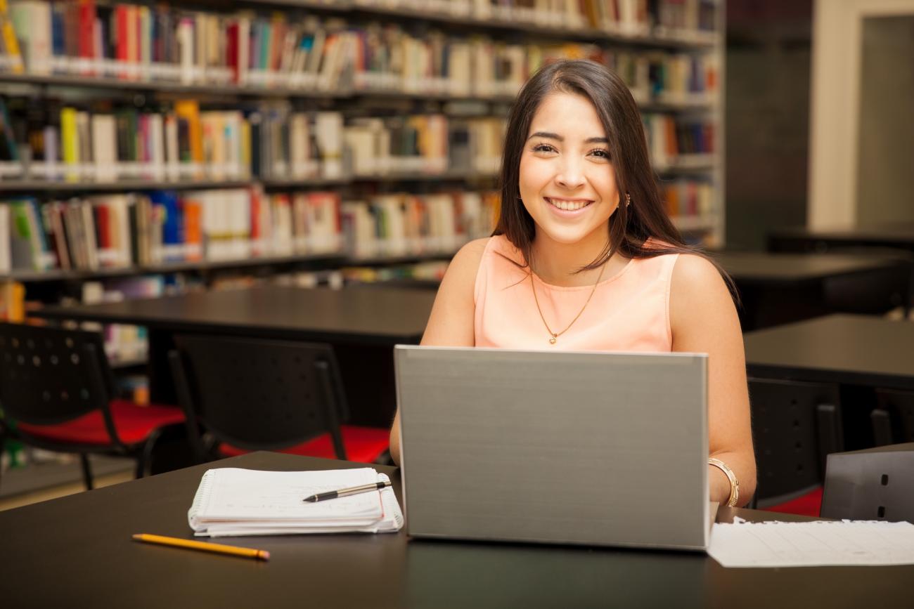 woman with a laptop in a library